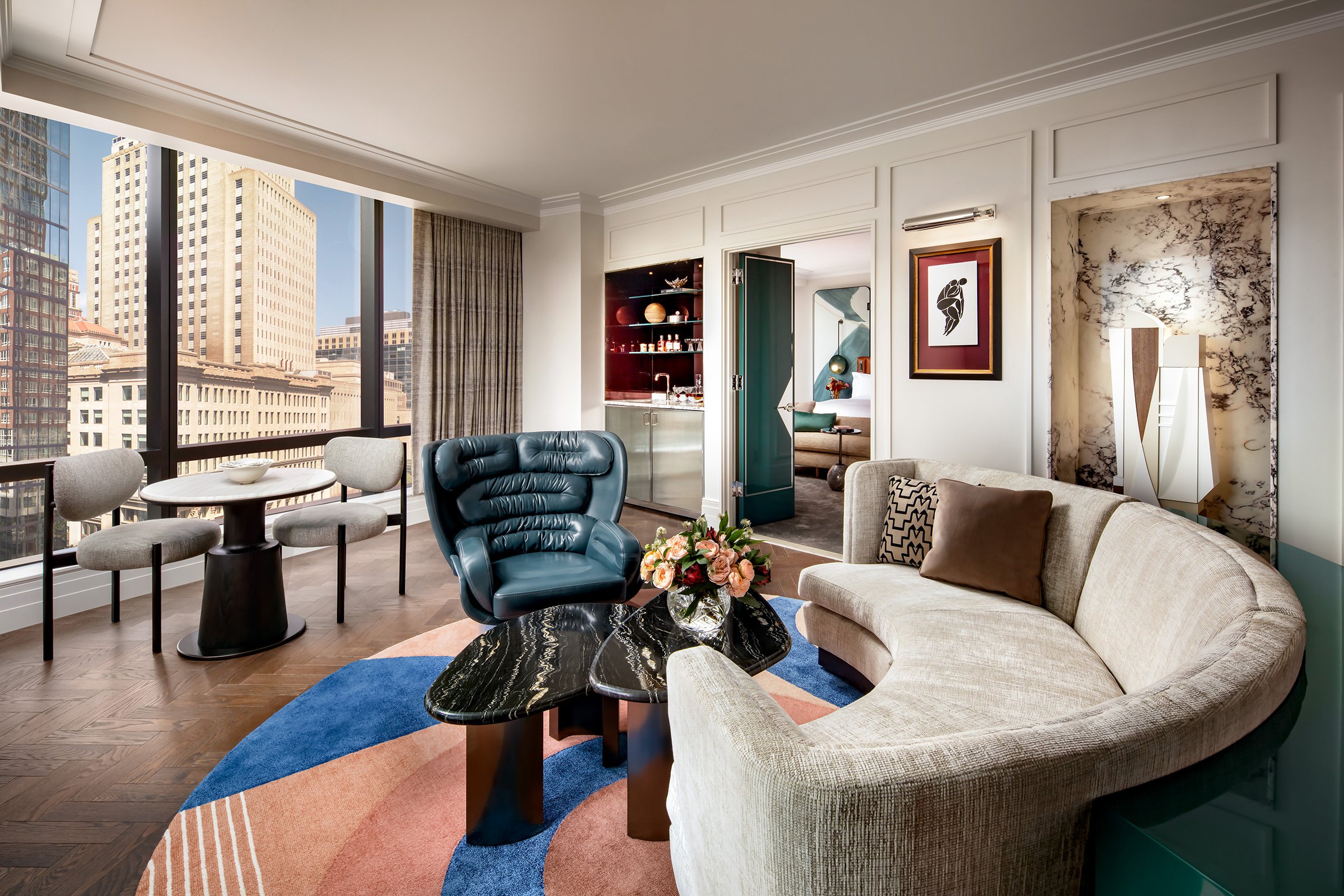 The living room of a premier suite at Raffles Boston hotel