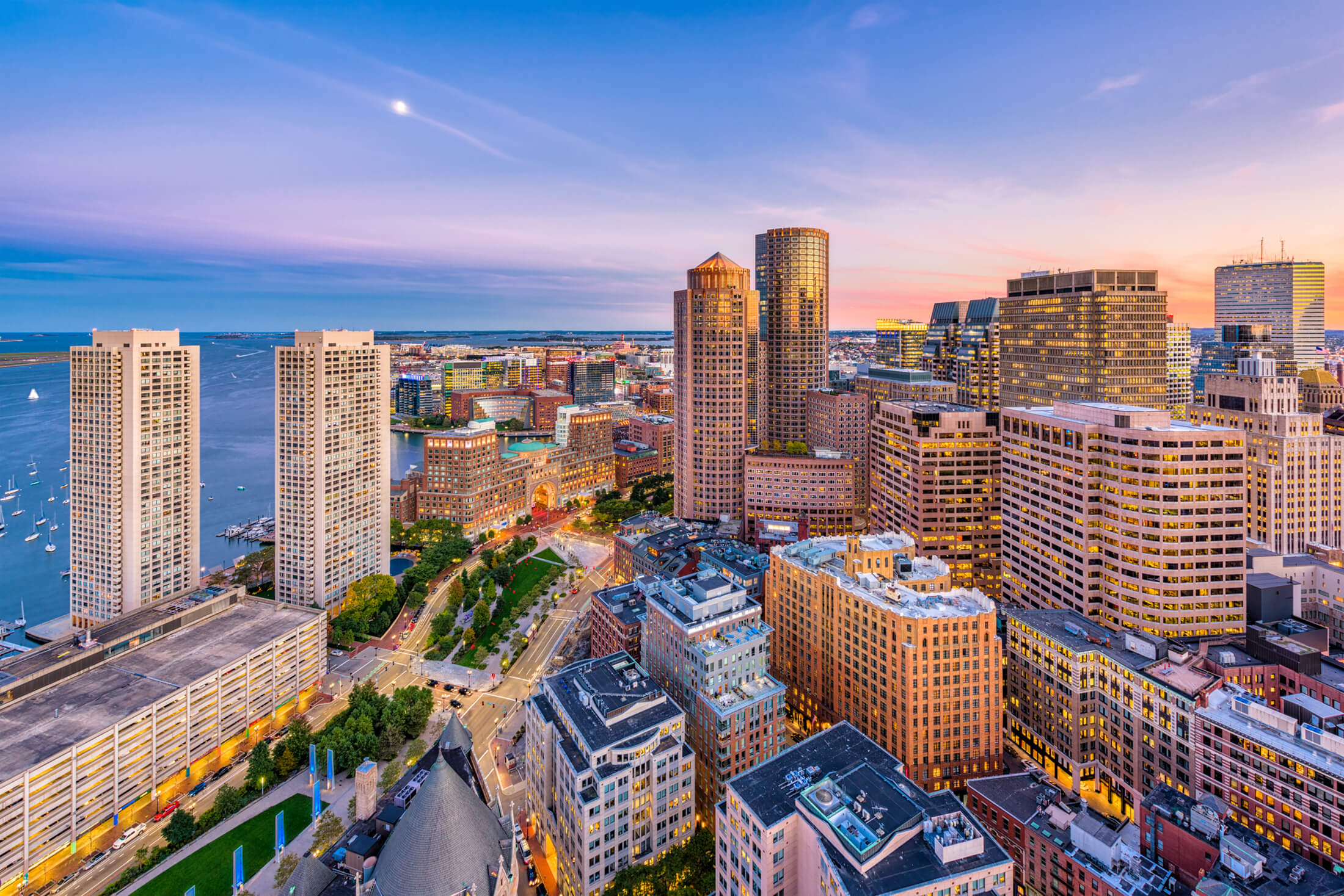 An aerial view of the Boston Financial District at sunset